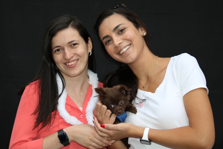 Two young women and a puppy