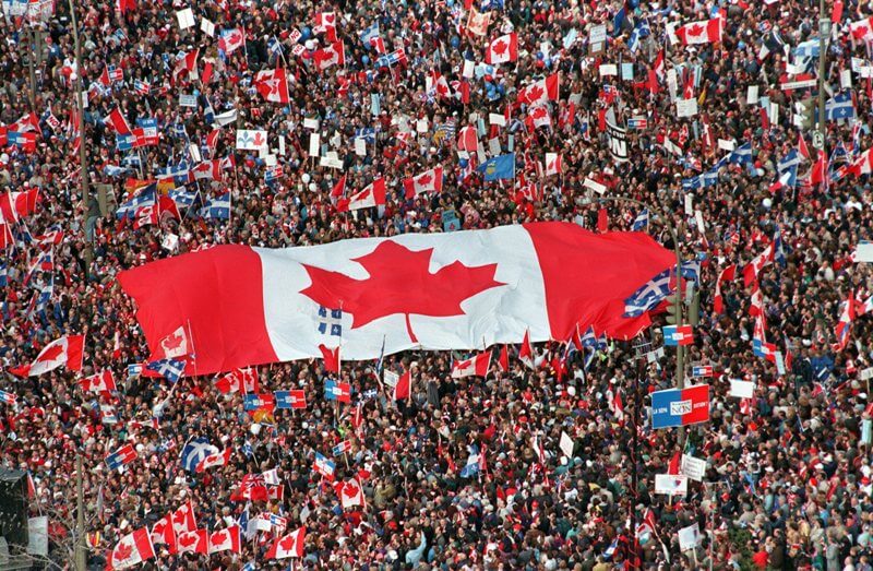 Canadian Flag carried by hundreds of people. Canada is a great place to get married.